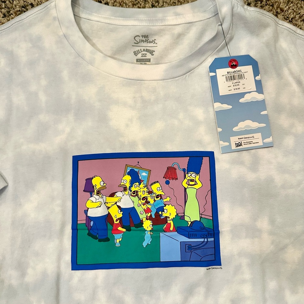 Billabong X Simpsons Couch Collectable
T-Shirt. Baby blue/white tie-dye NWT- XL